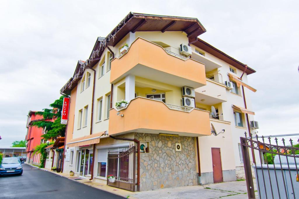 a building on the side of a street at Family Hotel Victoria Gold in Mineralni Bani