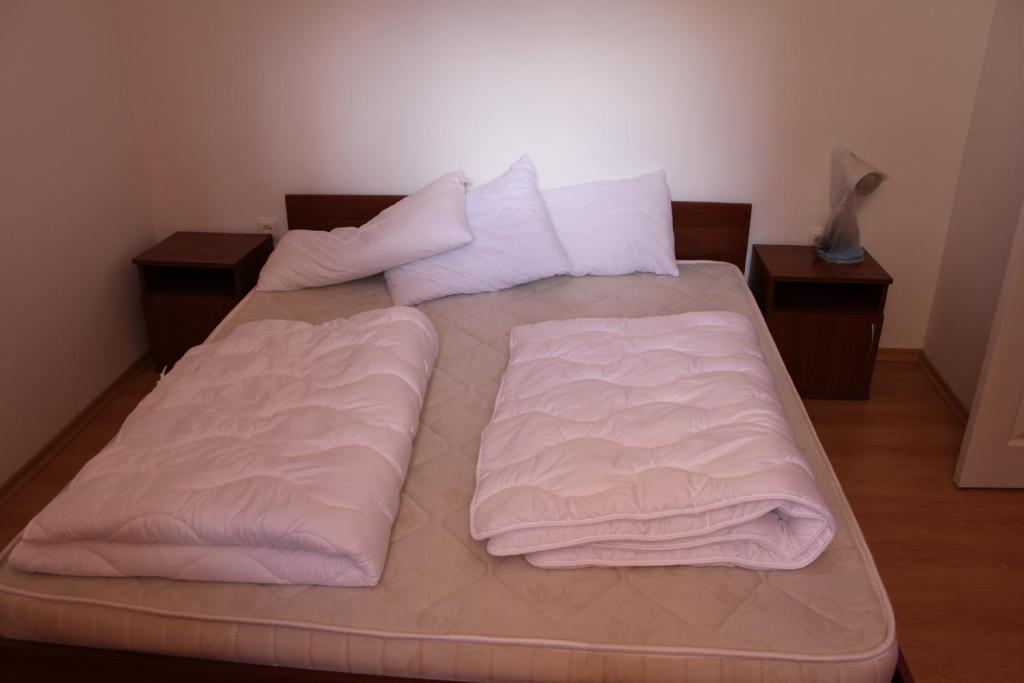 Postel nebo postele na pokoji v ubytování Abelia Residence Apartment Regina