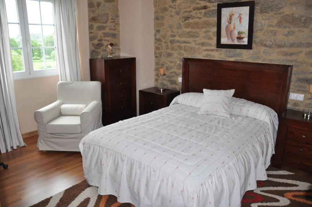 Postel nebo postele na pokoji v ubytování Casa Vilar de Friol