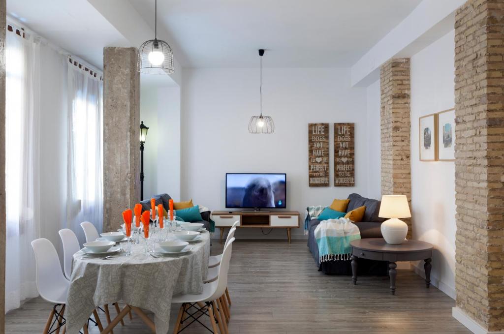 a living room with a table and a couch at TTdSSa VLC Purísima Street in Valencia