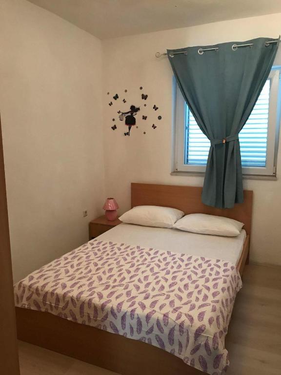 Postel nebo postele na pokoji v ubytování Apartments Sun & Sea