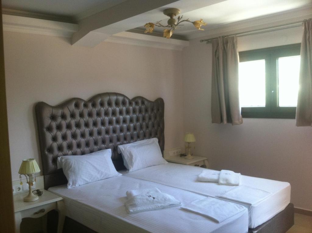 Postel nebo postele na pokoji v ubytování Palatino Hotel