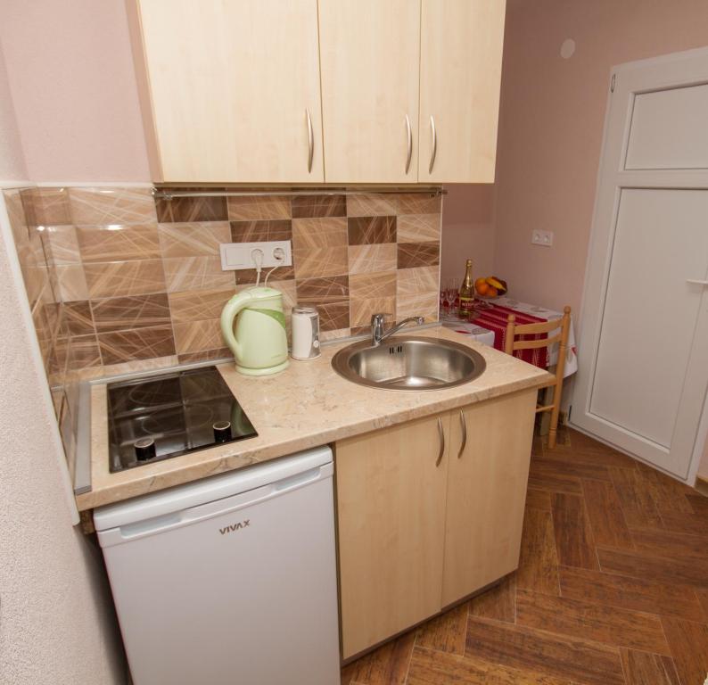 Kuchyň nebo kuchyňský kout v ubytování Apartments Bellavista