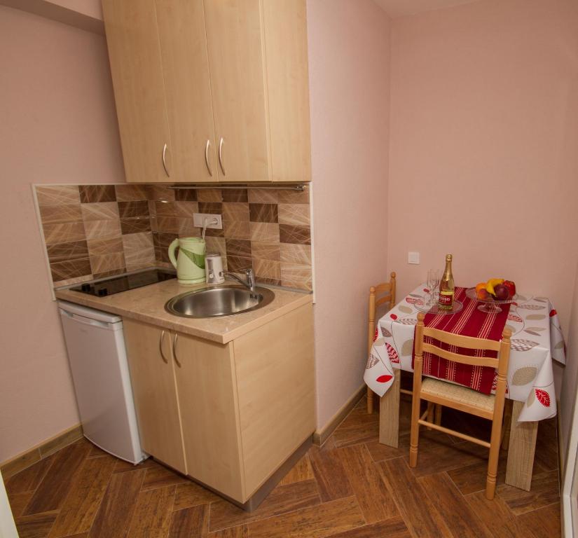 Kuchyň nebo kuchyňský kout v ubytování Apartments Bellavista