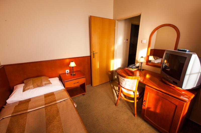 Postel nebo postele na pokoji v ubytování Park Hotel Tartuf