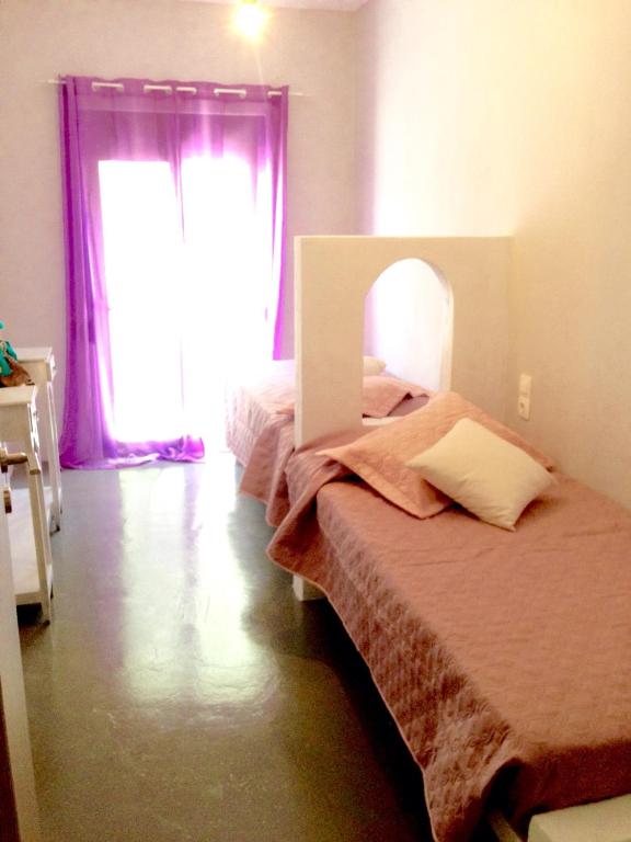 Postel nebo postele na pokoji v ubytování Heraklion Gortyn Phaistos House