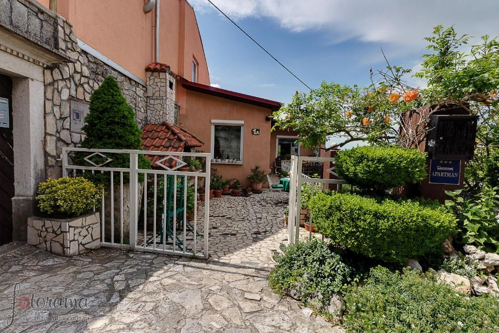 an entrance to a house with a gate at Rajski vrt in Crikvenica