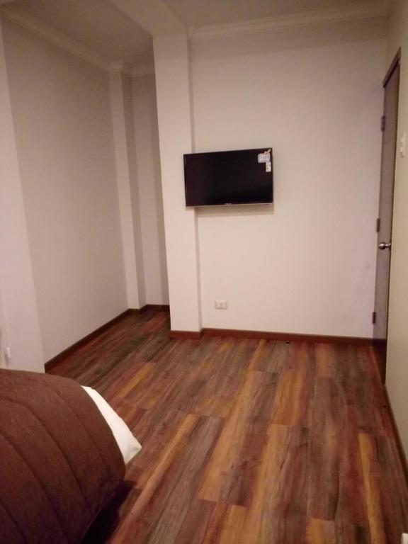 TV a/nebo společenská místnost v ubytování Hotel Elisa Cole