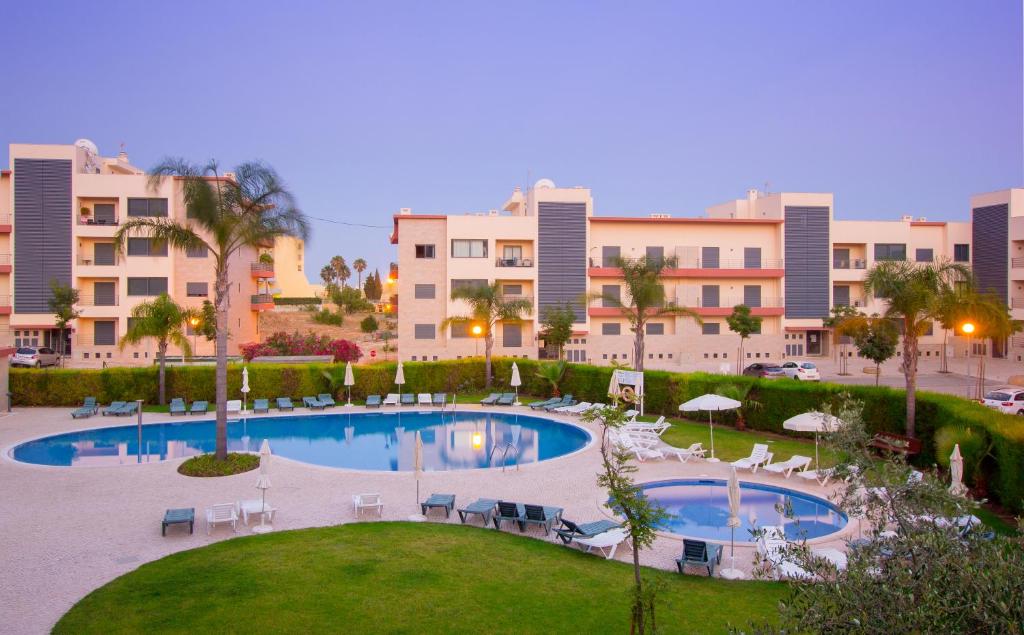 a view of a swimming pool with buildings in the background at Skyline View in Lagos