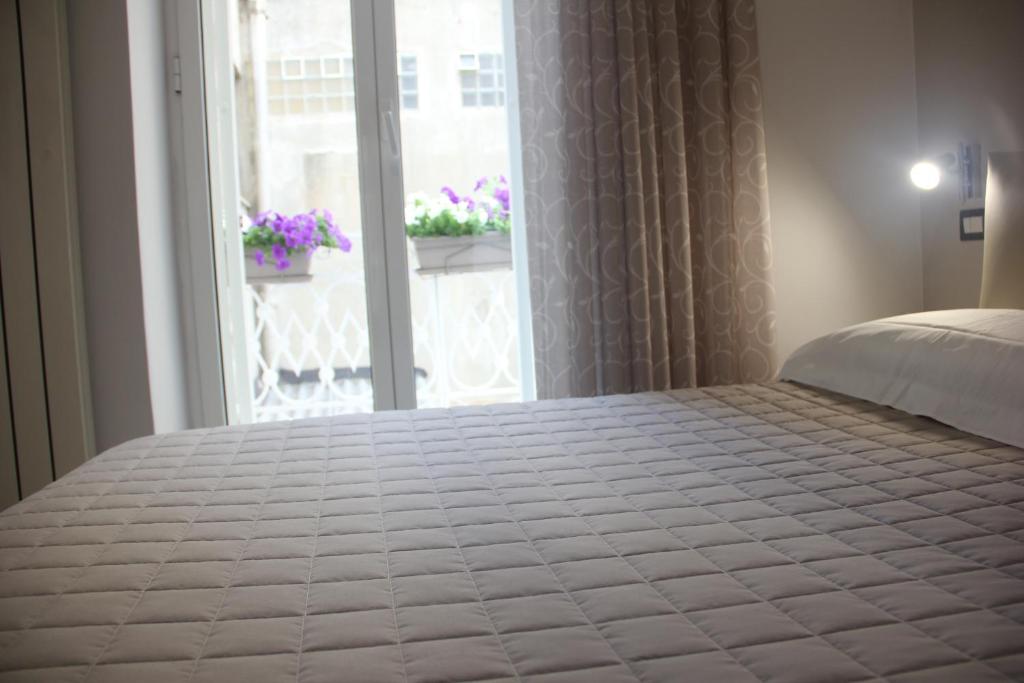 Letto o letti in una camera di Matera Guest House
