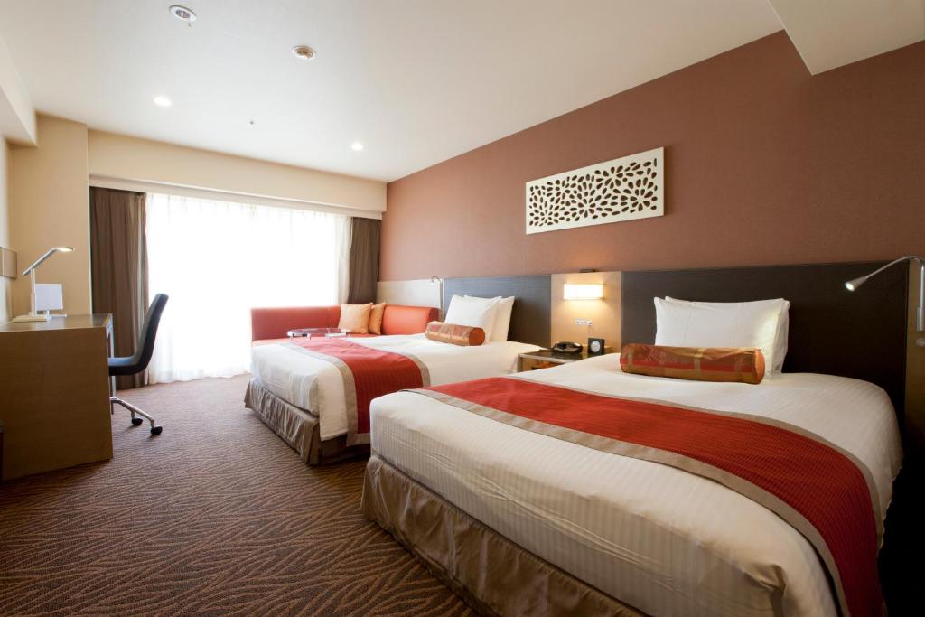 Postel nebo postele na pokoji v ubytování Hotel Sardonyx Tokyo