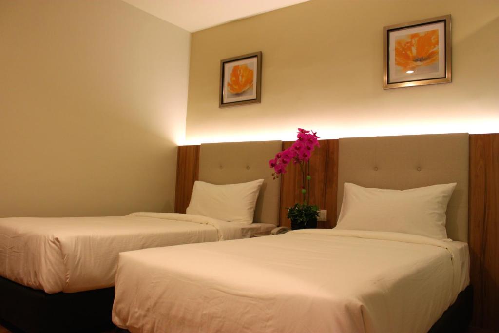 Postel nebo postele na pokoji v ubytování BIG M Hotel
