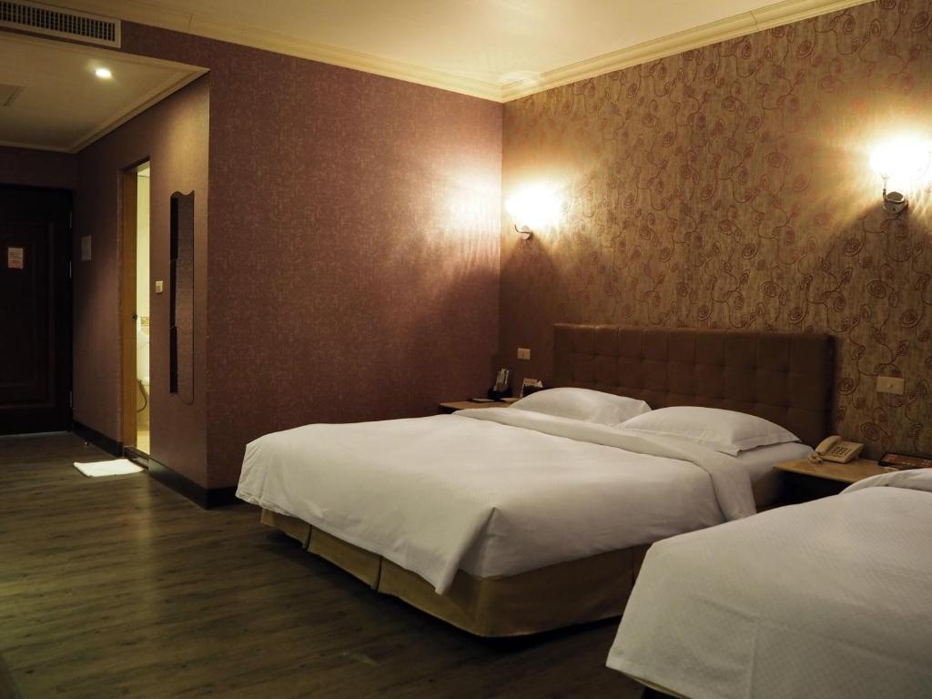 Postel nebo postele na pokoji v ubytování The Riverside Hotel & Motel