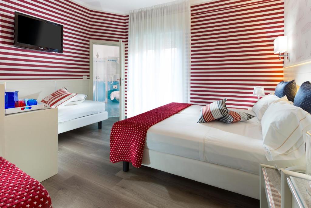 Postel nebo postele na pokoji v ubytování Hotel Atlantic Riviera Mare