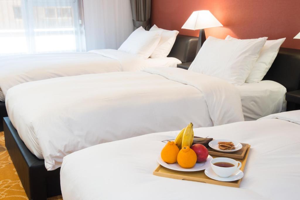 Postel nebo postele na pokoji v ubytování Hotel Leo