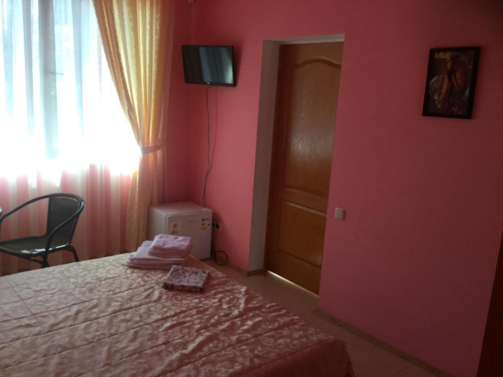 Postel nebo postele na pokoji v ubytování Aura