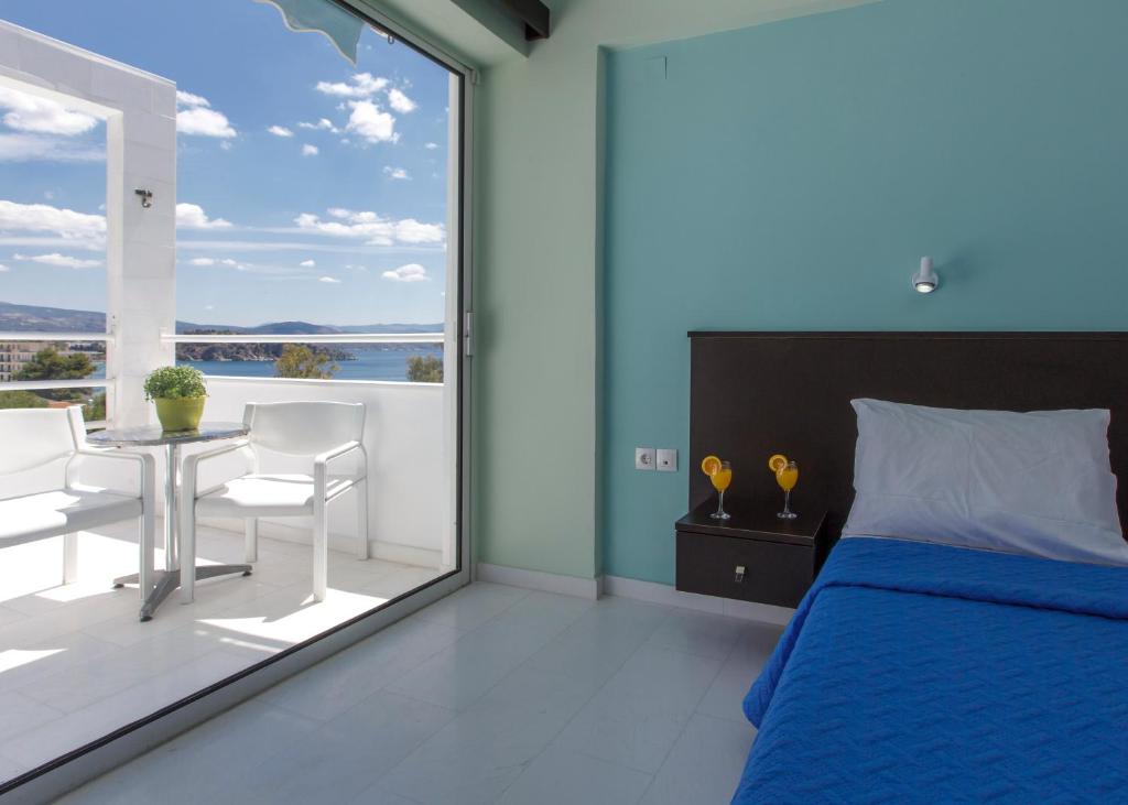 Postel nebo postele na pokoji v ubytování Asteria Hotel