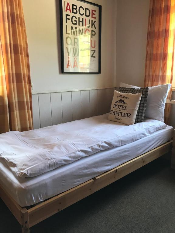 Postel nebo postele na pokoji v ubytování Hotel Staffler