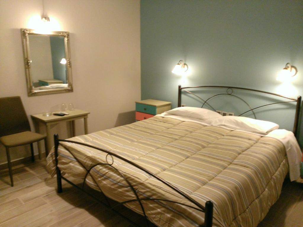 A bed or beds in a room at Artemis