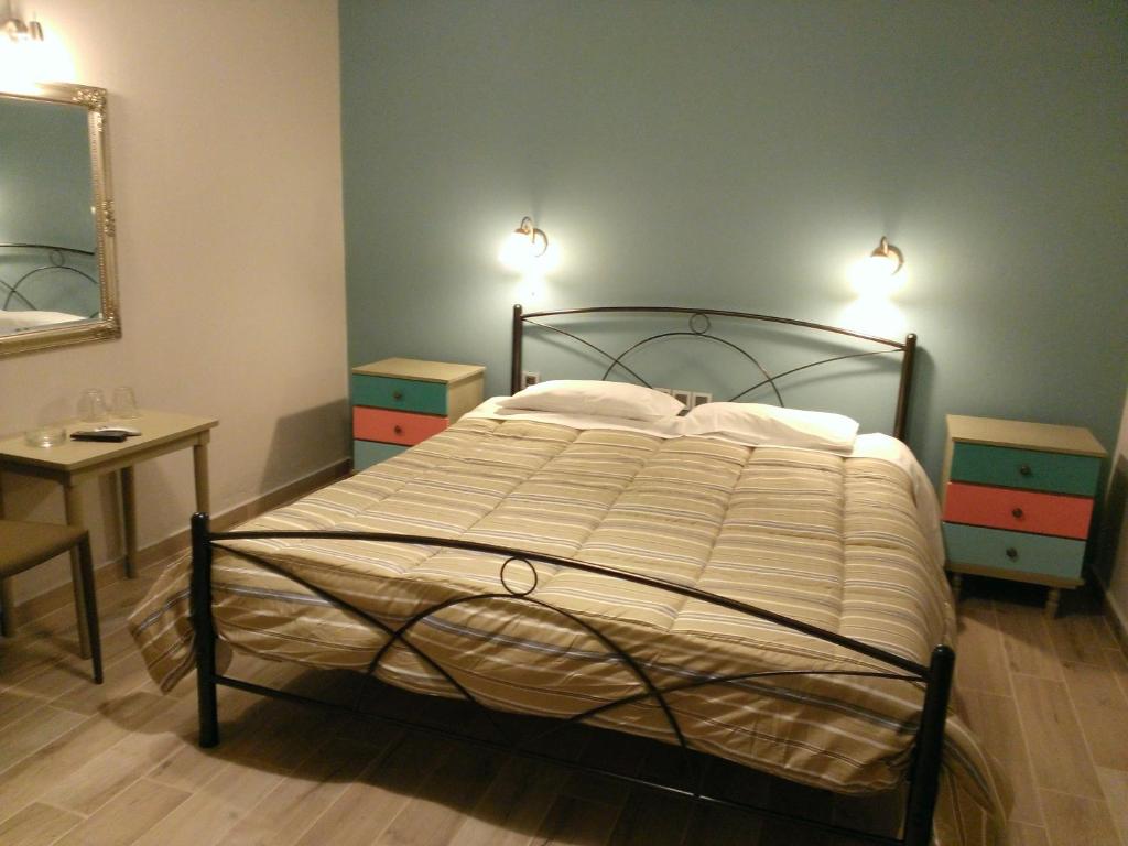 A bed or beds in a room at Artemis