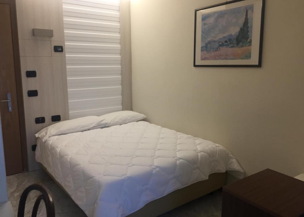 Posteľ alebo postele v izbe v ubytovaní Hotel Consuelo