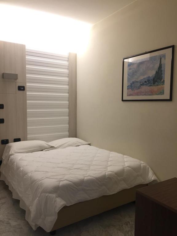 Posteľ alebo postele v izbe v ubytovaní Hotel Consuelo