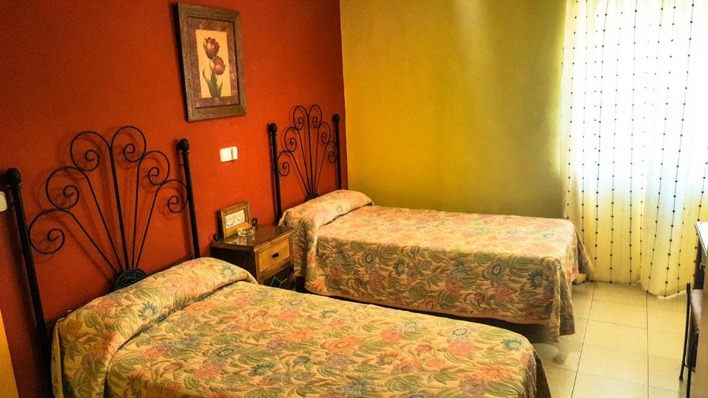 Posteľ alebo postele v izbe v ubytovaní Hostal Restaurante El Paso