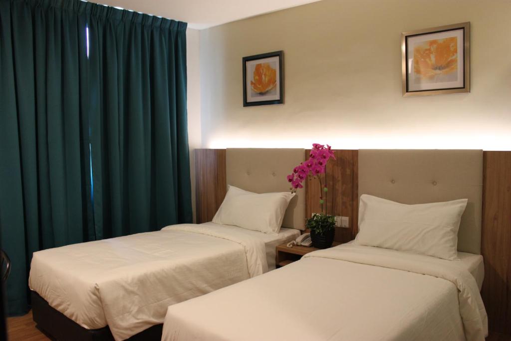 Postel nebo postele na pokoji v ubytování BIG M Hotel