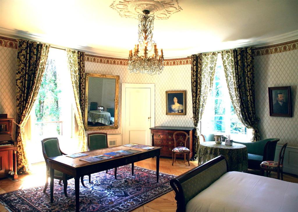 Posezení v ubytování La Villa Palladienne - Château de Syam