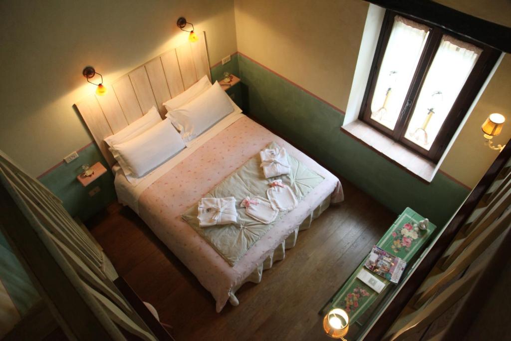 Postel nebo postele na pokoji v ubytování Agriturismo Tara