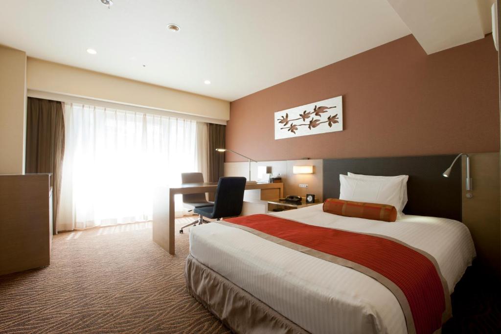 Postel nebo postele na pokoji v ubytování Hotel Sardonyx Tokyo