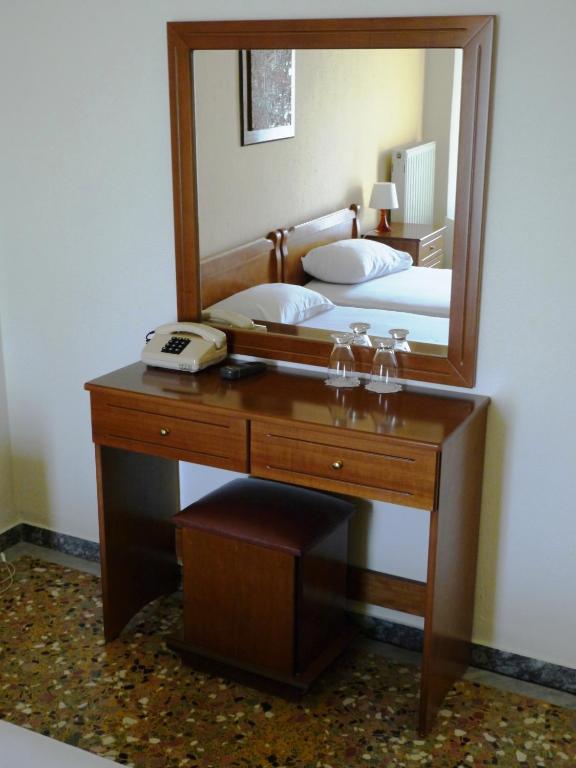 Postel nebo postele na pokoji v ubytování Hotel Markos