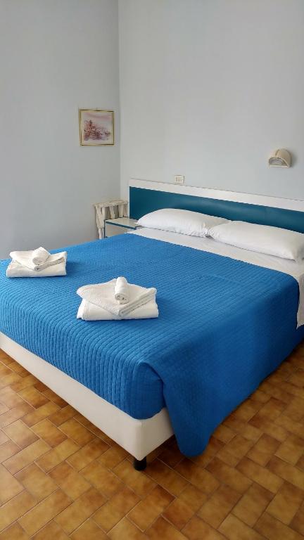 Postel nebo postele na pokoji v ubytování Hotel Biagini