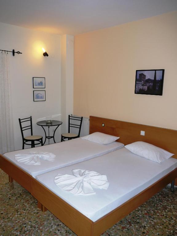 Postel nebo postele na pokoji v ubytování Hotel Markos