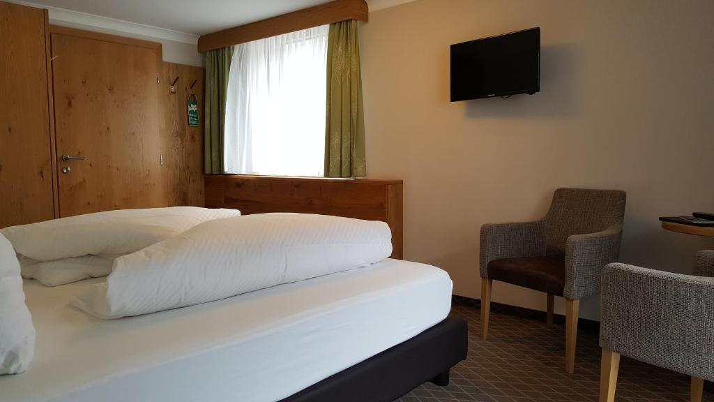 TV a/nebo společenská místnost v ubytování Hotel Mozart