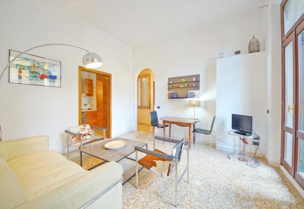a living room with a couch and a table at DolceVita Apartments N 331 in Venice