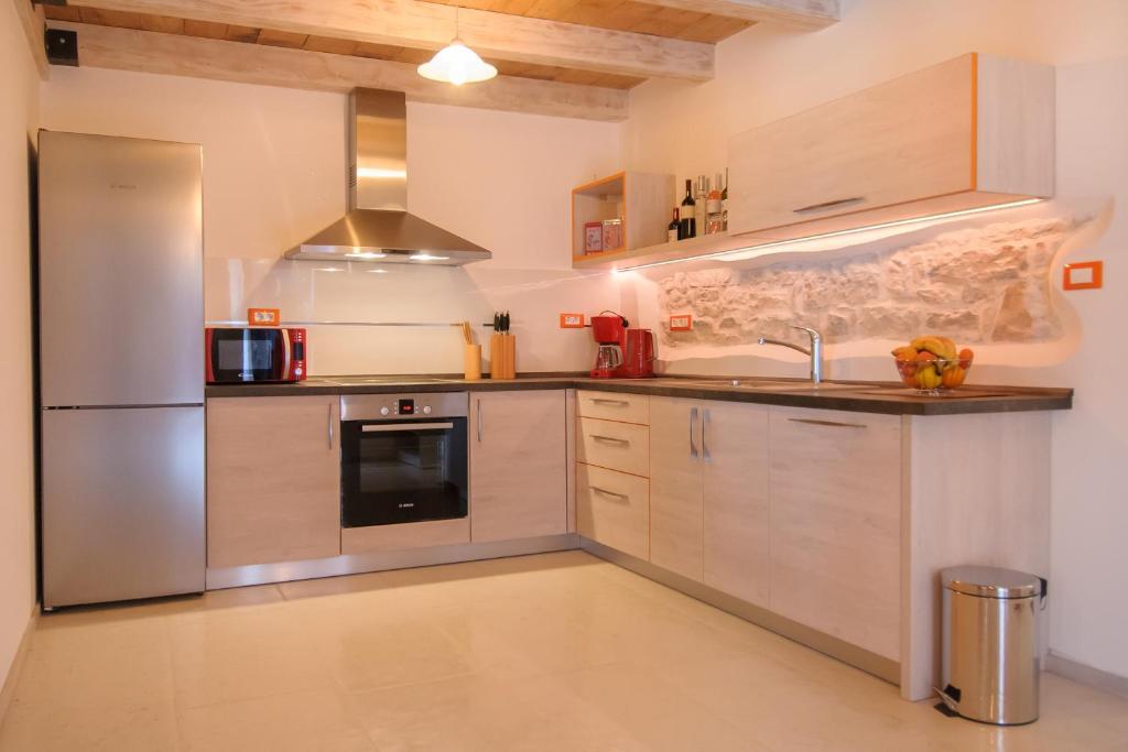 Kuchyň nebo kuchyňský kout v ubytování Apartments Borgo 8