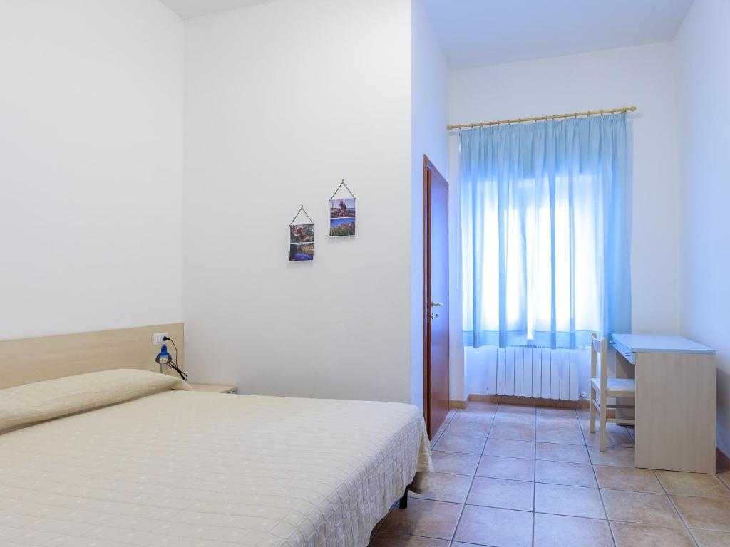 Postel nebo postele na pokoji v ubytování B&B Rose Villa
