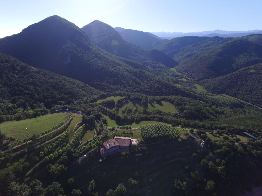 an aerial view of a valley with mountains at Mas Pineda in Oix