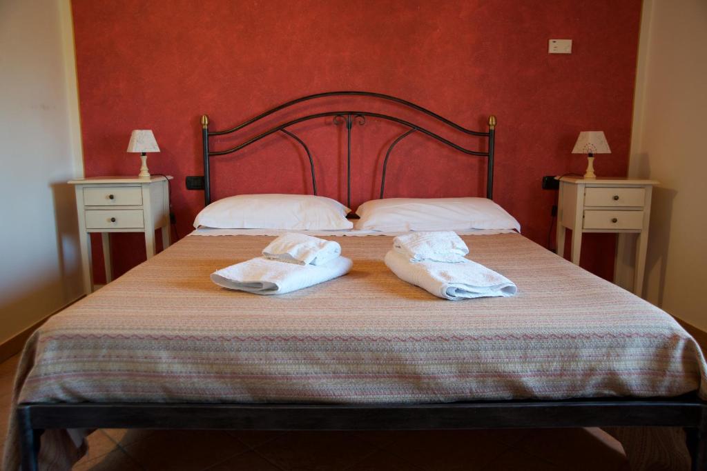 Postel nebo postele na pokoji v ubytování Agriturismo Albarello