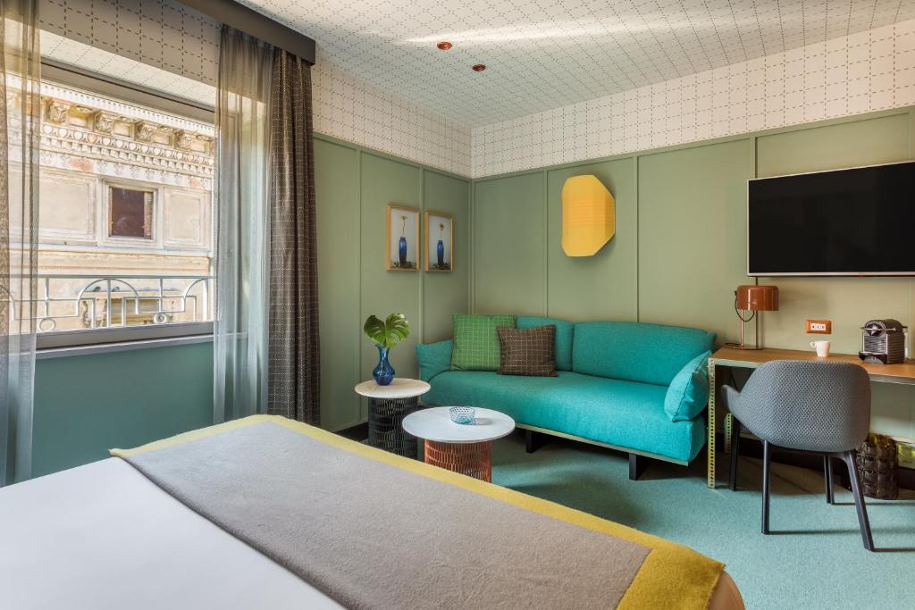 Postel nebo postele na pokoji v ubytování Room Mate Collection Giulia, Milan