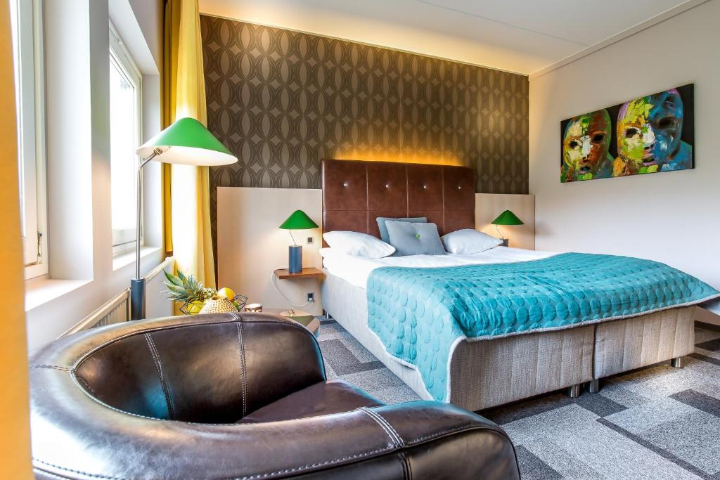 Postel nebo postele na pokoji v ubytování Hotel Lautrup Park
