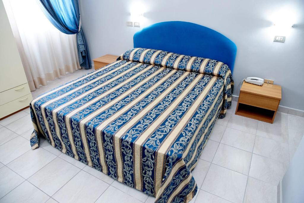 Postel nebo postele na pokoji v ubytování Hotel Ospite Inatteso