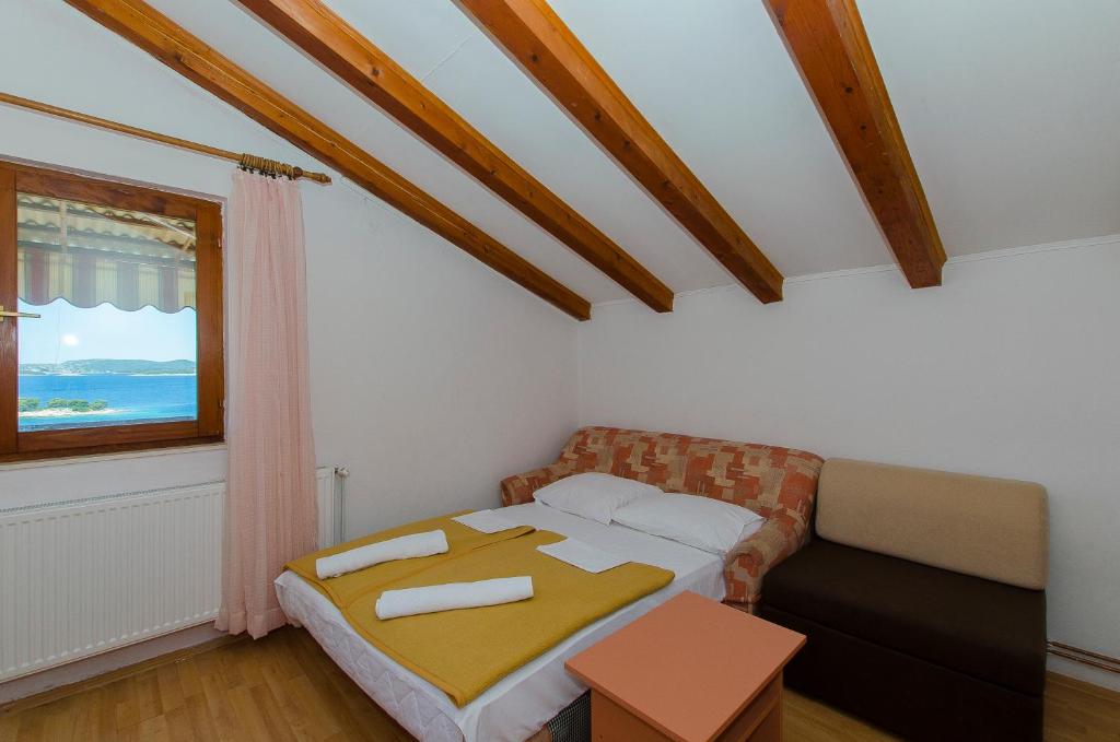 Postel nebo postele na pokoji v ubytování Apartments Bilo