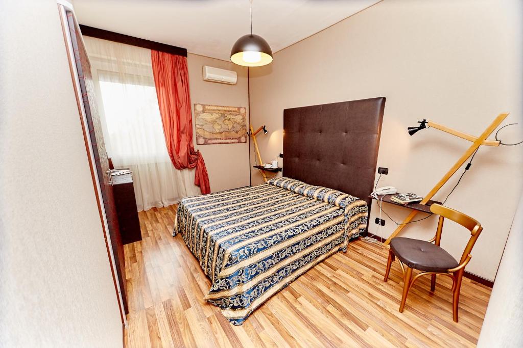 Postel nebo postele na pokoji v ubytování Hotel Ospite Inatteso