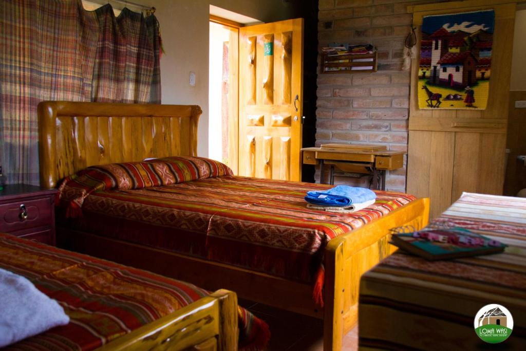 Postel nebo postele na pokoji v ubytování Casa Hotel Loma Wasi en Cotacachi
