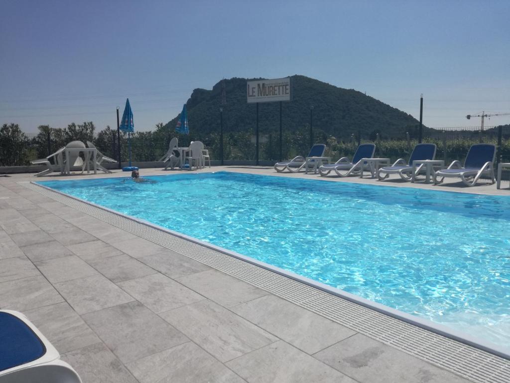 Bazén v ubytování B&B Le Murette - ENJOY HOLIDAY nebo v jeho okolí