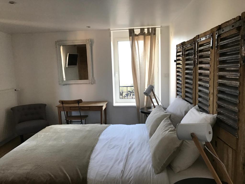 Postel nebo postele na pokoji v ubytování O Lodge