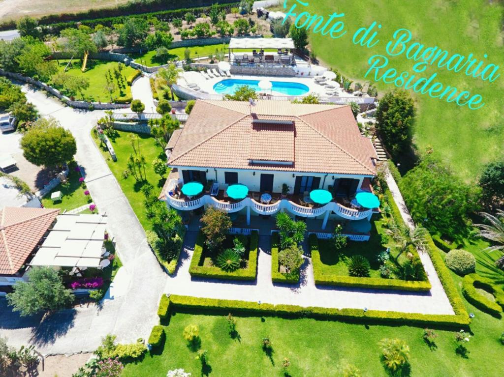 an aerial view of a mansion with a swimming pool at Fonte Di Bagnaria in Santa Domenica