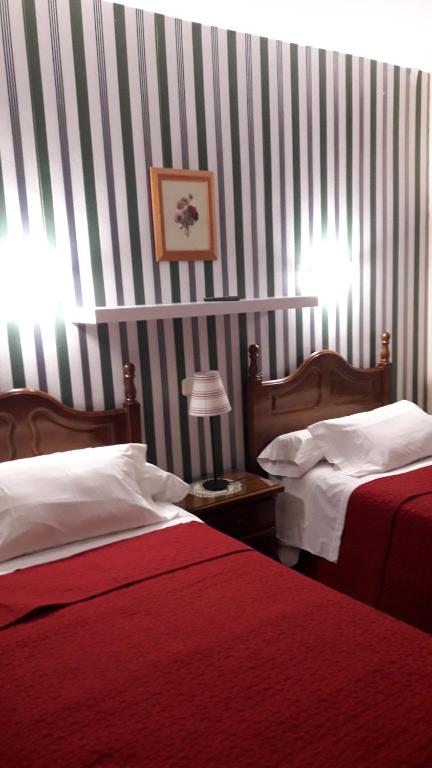 Postel nebo postele na pokoji v ubytování Hostal Martin - Sanabria